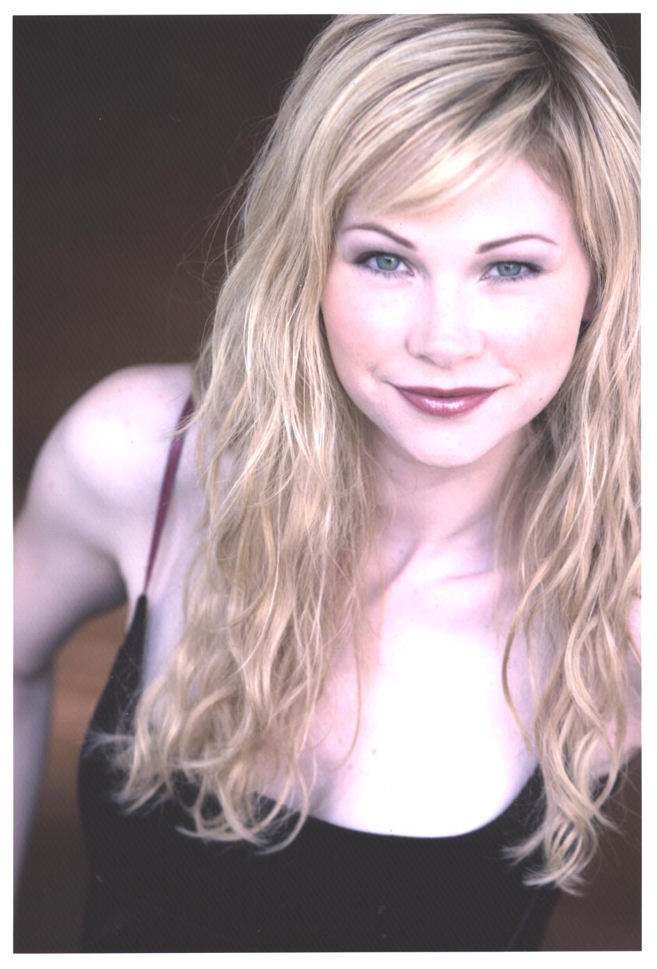 Headshot of actress Julia Lee — long blonde wavy hair with extensions, natural makeup, smiling softly to camera. Seen on TV show Angel S5.E22. Hair by Angeleah Daidone.